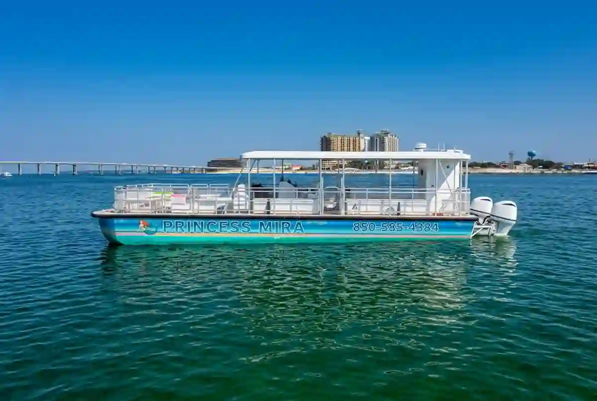 Princess Mira catamaran with her full blue-to-teal mermaid wrap and hulls visible